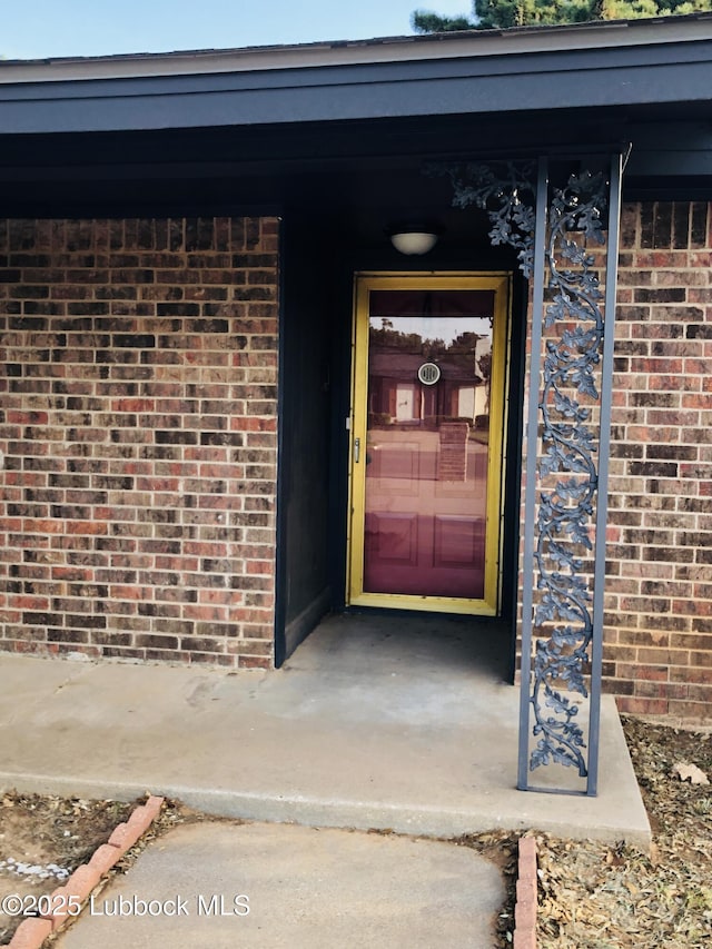 5712 73rd St, Lubbock, TX 79424 - view of exterior entry with brick siding