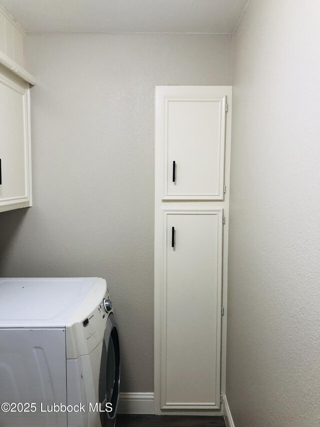 5712 73rd St, Lubbock, TX 79424 - laundry area with washer / clothes dryer, cabinet space, and baseboards