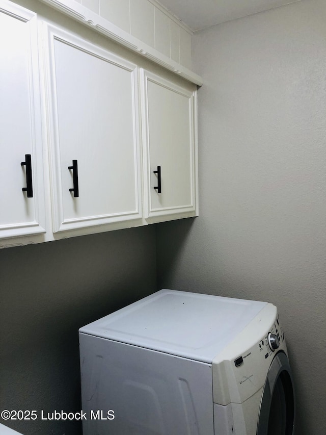 5712 73rd St, Lubbock, TX 79424 - washroom with washer / dryer and cabinet space