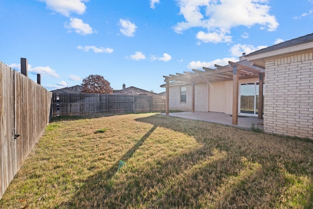 view of yard with a pergola and a patio area