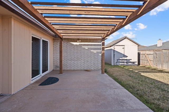 view of patio / terrace featuring a pergola and a storage shed