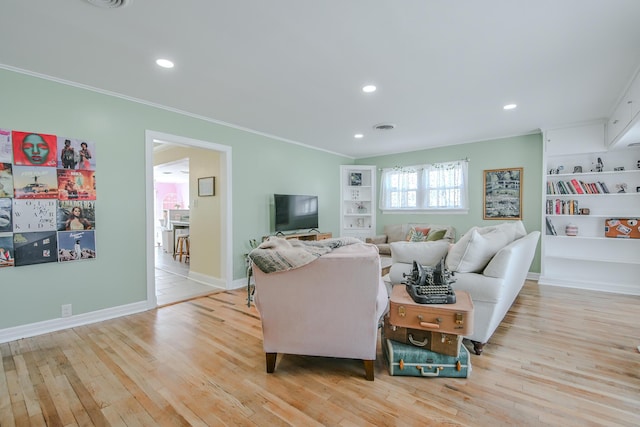 3123 22nd St, Lubbock, TX 79410 - living room with crown molding, recessed lighting, and wood finished floors