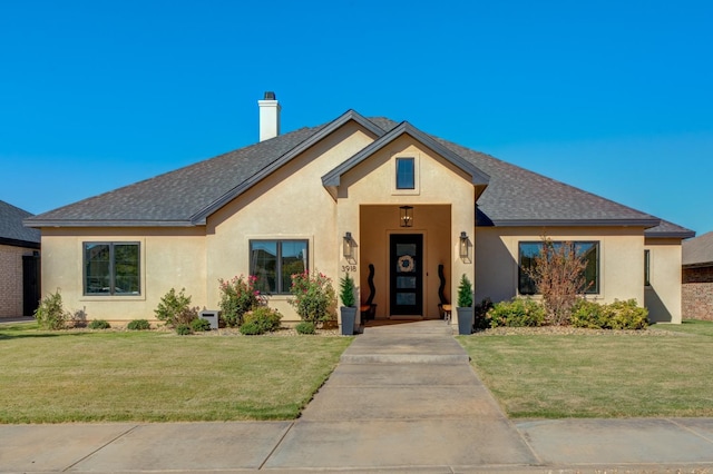 view of front of house with a front lawn