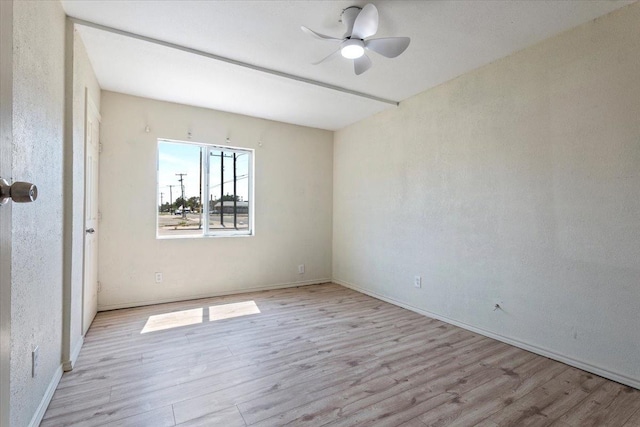 unfurnished room with light hardwood / wood-style flooring and ceiling fan