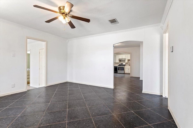 unfurnished room featuring crown molding, dark tile patterned floors, and ceiling fan