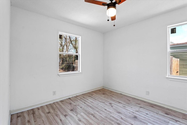 spare room with ceiling fan and light hardwood / wood-style floors