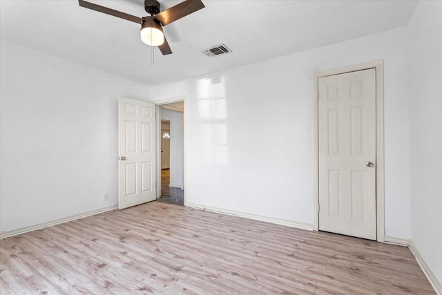 unfurnished room with ceiling fan and light hardwood / wood-style flooring