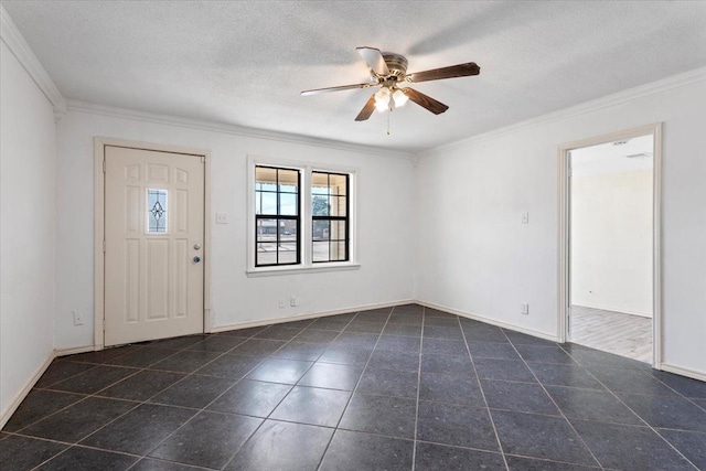 entrance foyer with crown molding, ceiling fan, a textured ceiling, and dark tile patterned floors