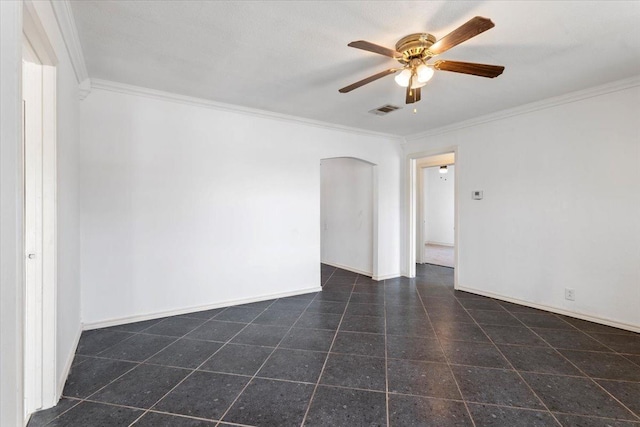 empty room featuring ceiling fan and ornamental molding