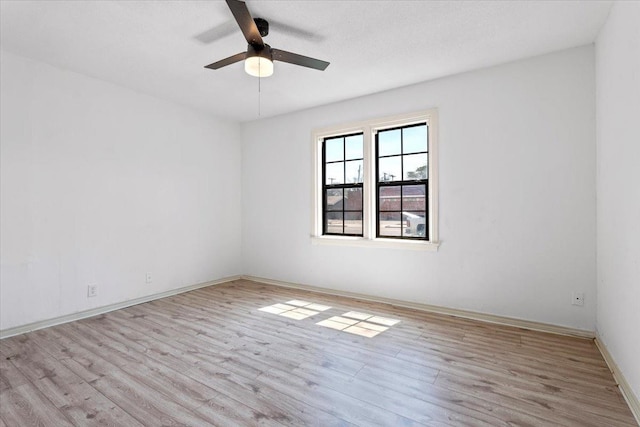 unfurnished room featuring ceiling fan and light wood-type flooring