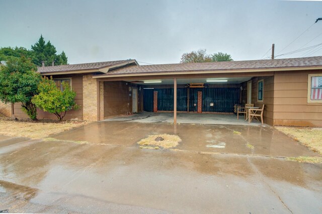 exterior space with a carport