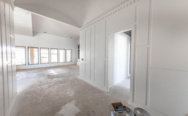 hallway with lofted ceiling