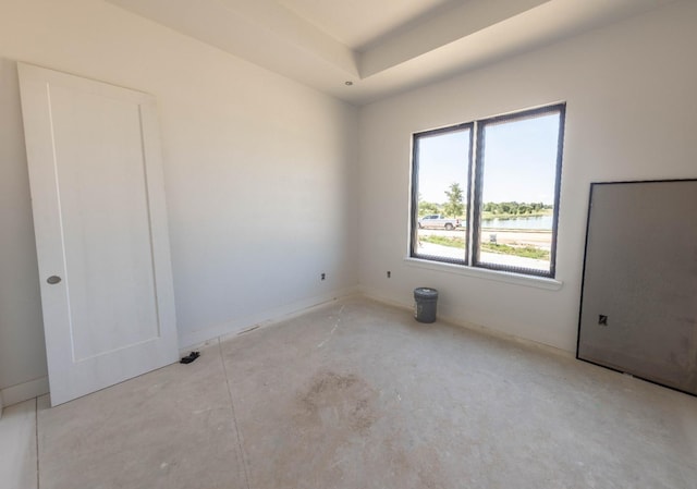 spare room featuring a water view