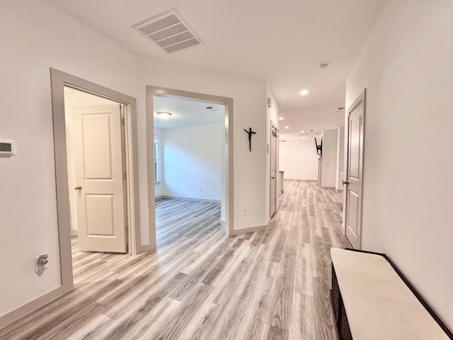 hallway with light wood-type flooring