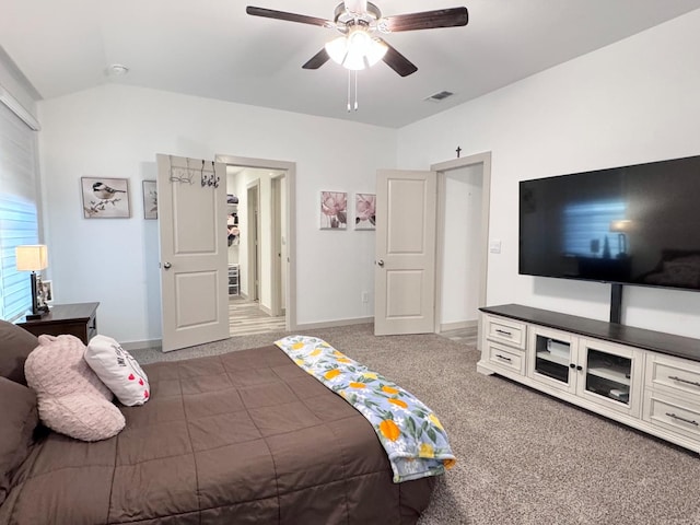 bedroom with lofted ceiling, carpet flooring, and ceiling fan