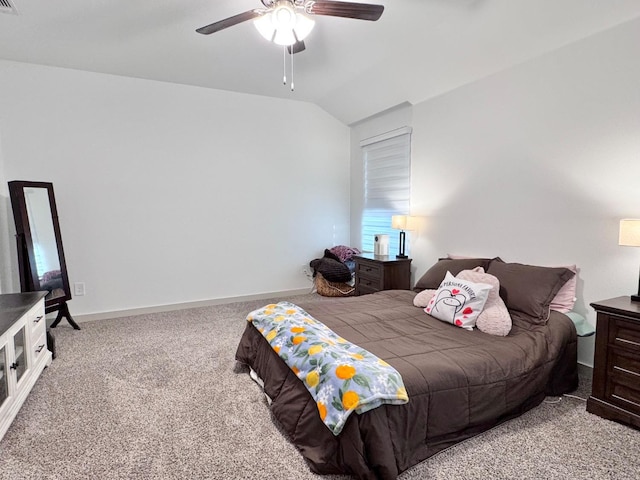 bedroom featuring ceiling fan, vaulted ceiling, and carpet