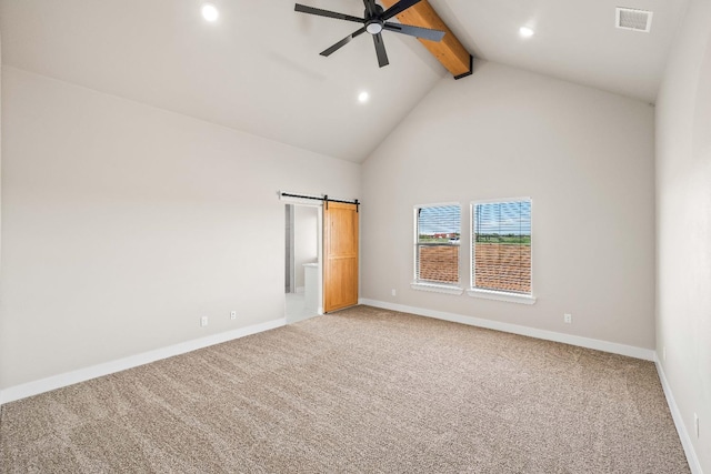 unfurnished bedroom featuring high vaulted ceiling, carpet floors, beamed ceiling, ceiling fan, and a barn door