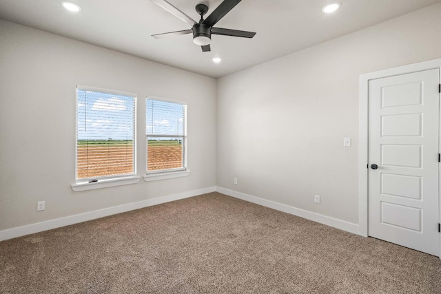 carpeted empty room with ceiling fan