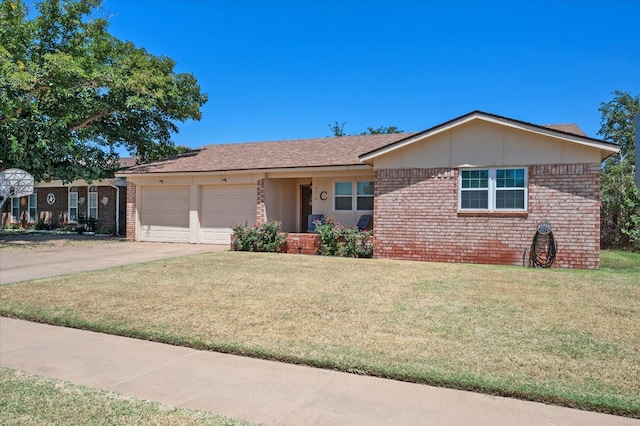 ranch-style home featuring a garage and a front yard