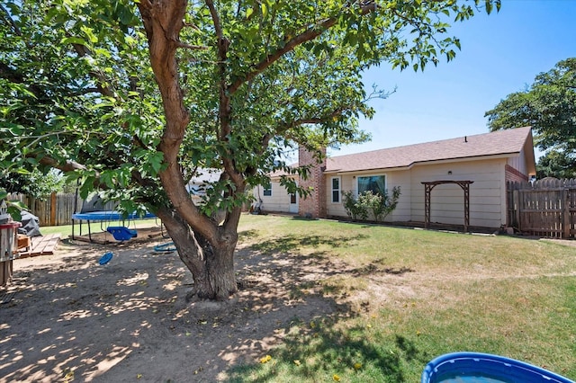 view of yard featuring a trampoline