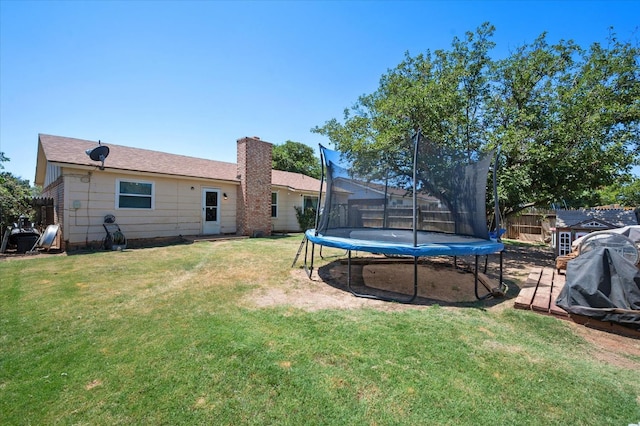 view of yard with a trampoline