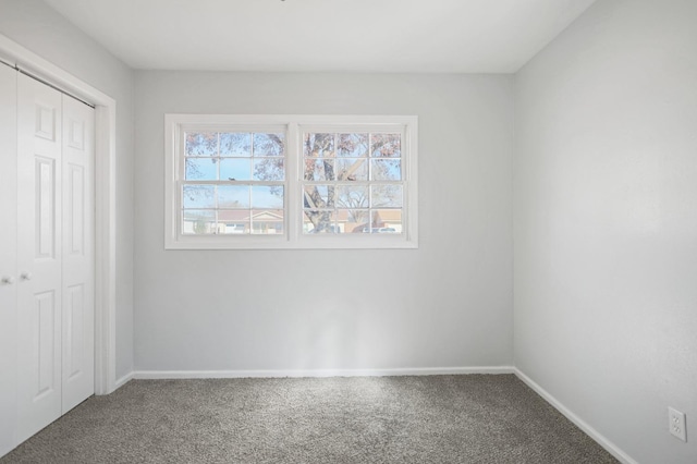 5217 45th St, Lubbock, TX 79414 - unfurnished bedroom featuring carpet flooring, a closet, and baseboards