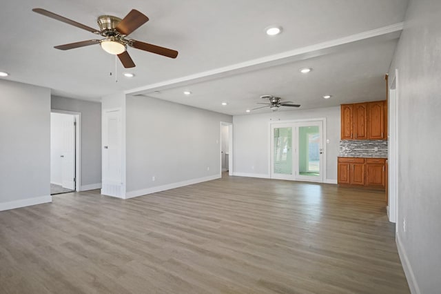 5217 45th St, Lubbock, TX 79414 - unfurnished living room featuring recessed lighting, ceiling fan, baseboards, and wood finished floors