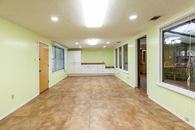 interior space featuring a textured ceiling