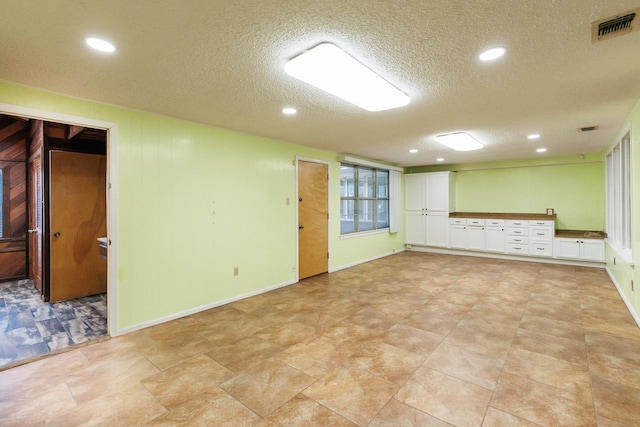 basement with a textured ceiling