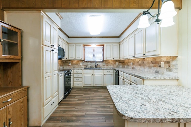 kitchen featuring electric range oven, pendant lighting, sink, white cabinets, and a textured ceiling