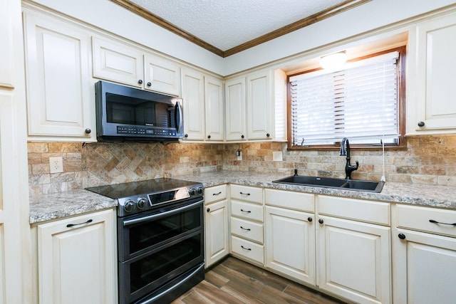 kitchen with dark wood-type flooring, sink, a textured ceiling, ornamental molding, and double oven range