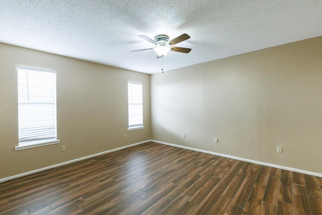 spare room featuring a textured ceiling, dark hardwood / wood-style floors, and ceiling fan