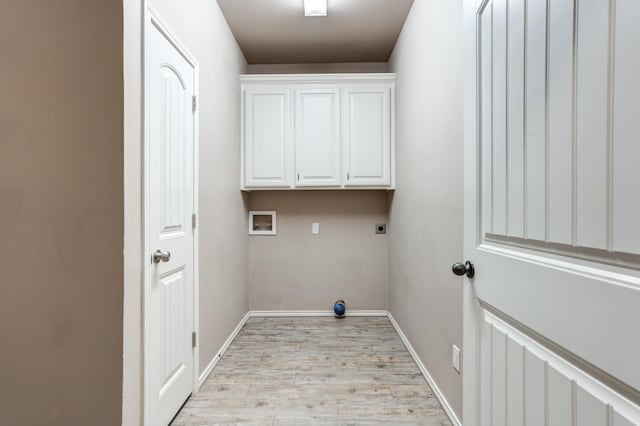 laundry room featuring cabinets, hookup for a washing machine, hookup for an electric dryer, and light wood-type flooring