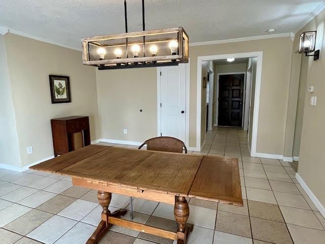 unfurnished dining area featuring ornamental molding, a textured ceiling, and light tile patterned floors