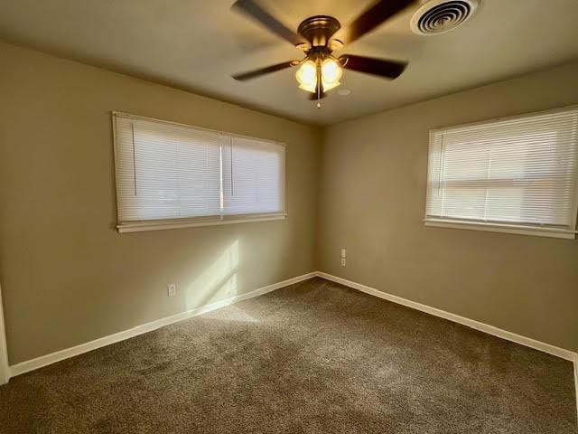 carpeted empty room with ceiling fan