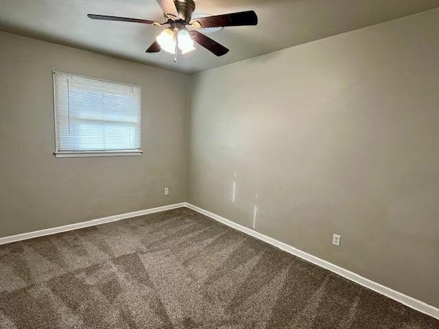 unfurnished room featuring carpet floors and ceiling fan