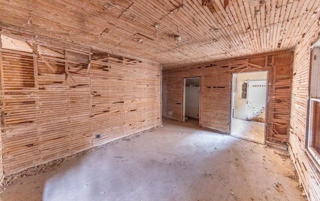 miscellaneous room with wooden walls