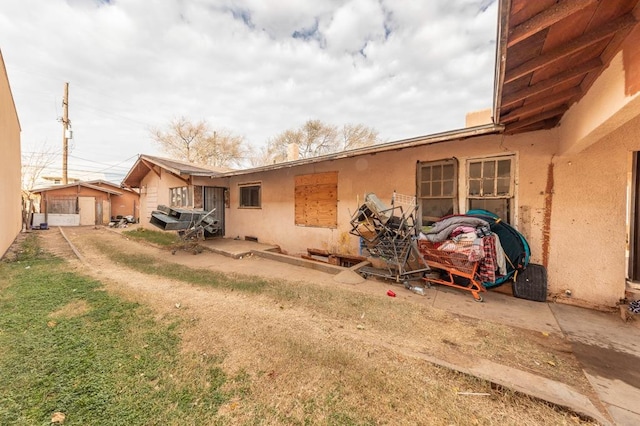 rear view of property with a garage