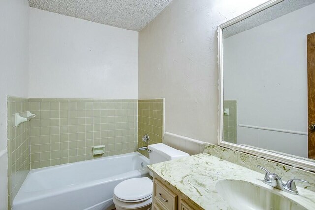 8206 Louisville Ave, Lubbock, TX 79423 - full bathroom with a textured ceiling, a garden tub, and vanity