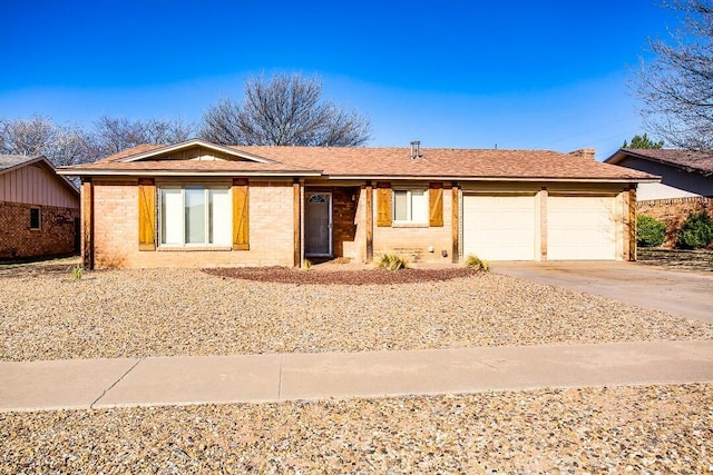 8206 Louisville Ave, Lubbock, TX 79423 - single story home with a garage, driveway, and brick siding