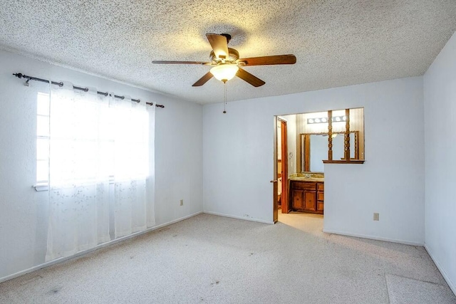 8206 Louisville Ave, Lubbock, TX 79423 - carpeted empty room with a ceiling fan and a textured ceiling