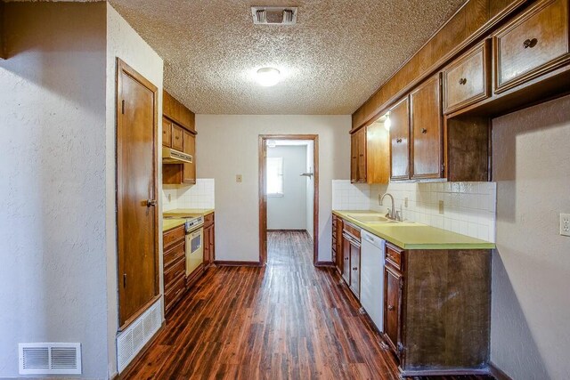 8206 Louisville Ave, Lubbock, TX 79423 - kitchen with backsplash, a textured ceiling, white dishwasher, electric stove, and under cabinet range hood