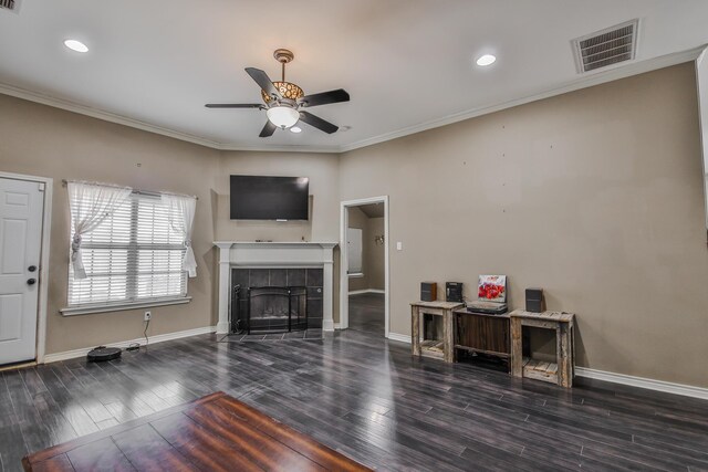 interior space featuring ceiling fan with notable chandelier, dark wood-type flooring, and ornamental molding