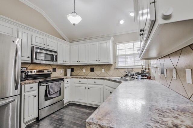 living room with dark wood-type flooring, ceiling fan, crown molding, and a tile fireplace