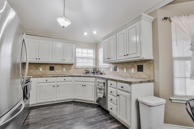 kitchen with white cabinetry, stainless steel appliances, and pendant lighting