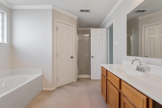 bathroom with shower with separate bathtub, ornamental molding, vanity, and a textured ceiling