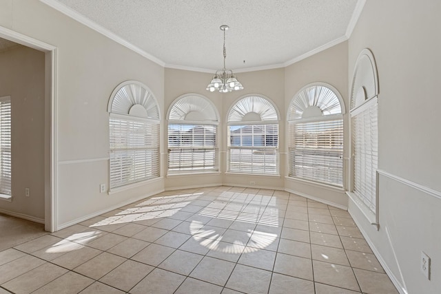 unfurnished dining area with a notable chandelier, crown molding, a textured ceiling, and light tile patterned flooring