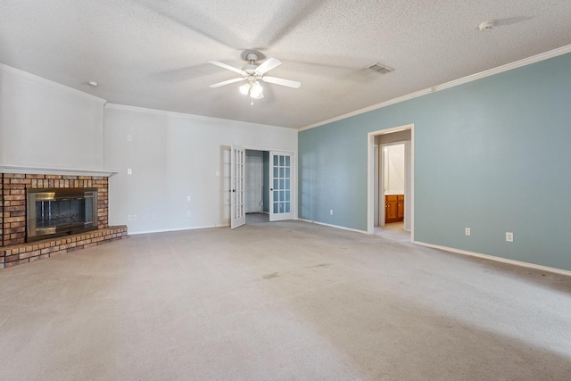 unfurnished living room featuring ornamental molding, a brick fireplace, a textured ceiling, and ceiling fan