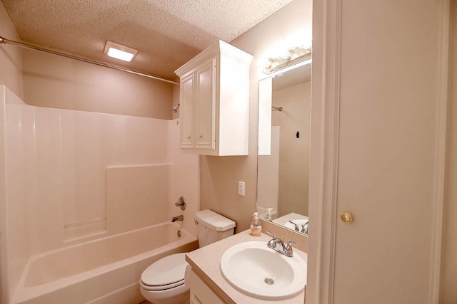 full bathroom with shower / washtub combination, toilet, a textured ceiling, and vanity