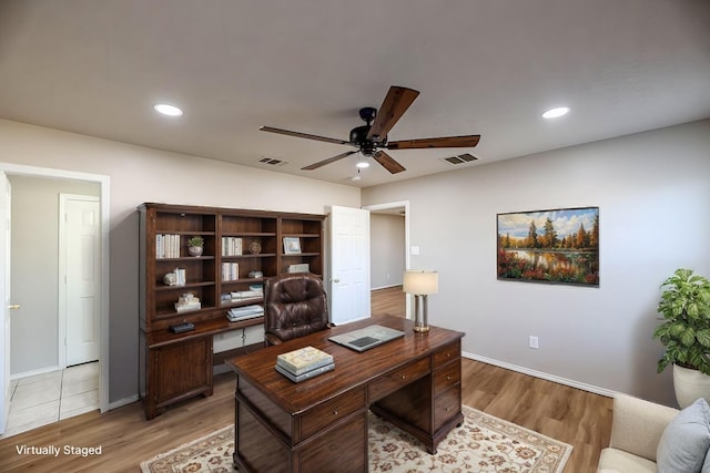 office area with ceiling fan and light hardwood / wood-style flooring